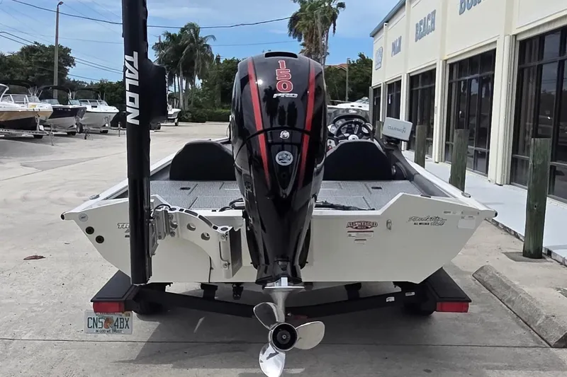 Slide: The Image of 2023 Tracker Pro Team 195 TXW Tournament Edition boat with powerful outboard motor. - 2