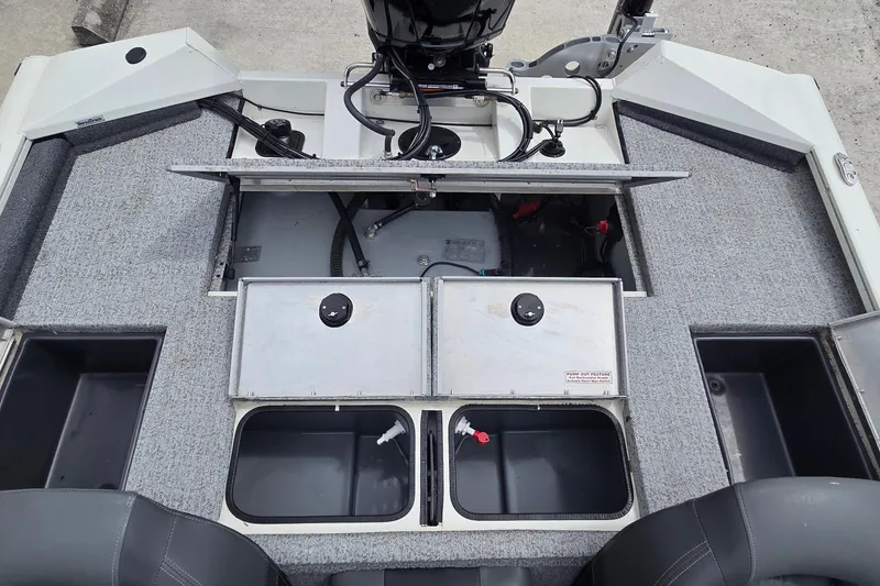 Slide: The Image of 2023 Tracker Pro Team 195 TXW Tournament Edition boat interior with open storage compartments. - 5