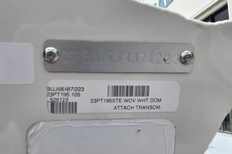 Slide: The Image of 2023 Tracker Pro Team 195 TXW Tournament Edition transom with identification plate and barcode. - 7