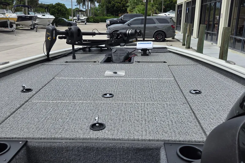 Slide: The Image of 2023 Tracker Pro Team 195 TXW Tournament Edition boat deck with fishing equipment. - 8