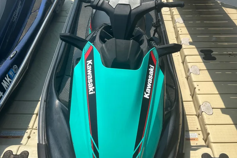 Slide: The Image of 2021 Kawasaki Jetski STX 160X on dock, top view of seat and controls. - 6