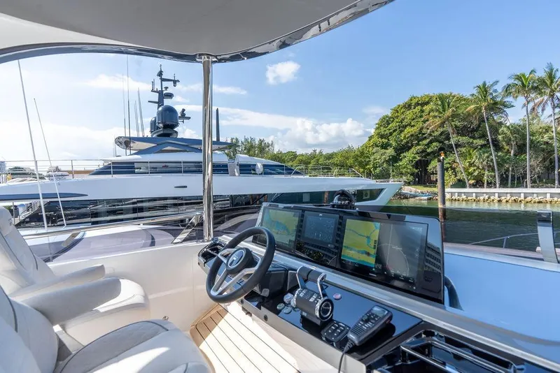 Slide: The Image of Luxury yacht Princess S65 2026 with modern cockpit and scenic harbor view. - 39