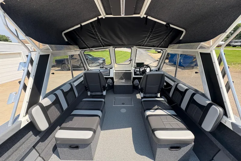 Slide: The Image of Interior of 2026 Lund 210 HG boat with modern seating and dashboard. - 16