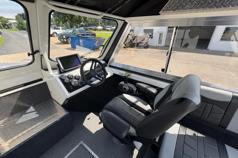 Slide: The Image of Interior of 2026 Lund 210 HG boat with modern steering and dashboard. - 17