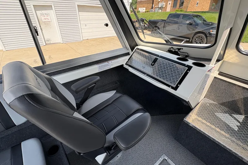 Slide: The Image of Interior of 2026 Lund 210 HG boat with modern seating and dashboard. - 19