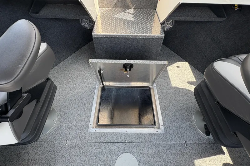 Slide: The Image of Interior of 2026 Lund 210 HG boat with open storage compartment. - 22