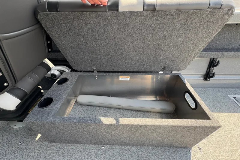 Slide: The Image of Open storage compartment in 2026 Lund 210 HG boat with cushioned seat. - 24