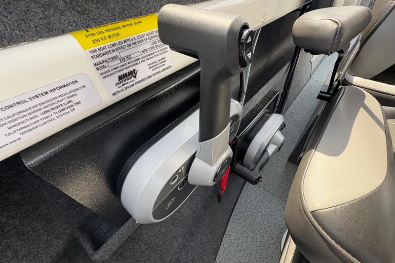 Slide: The Image of Interior view of 2026 Lund 210 HG boat control panel and seating. - 25