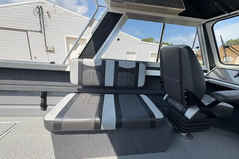 Slide: The Image of 2026 Lund 210 HG boat interior with modern seating and sleek design. - 27