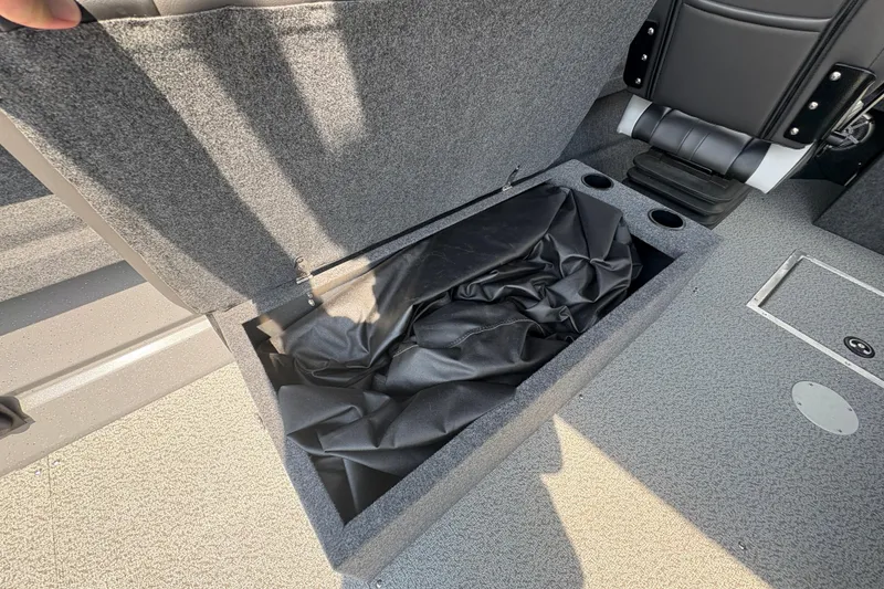 Slide: The Image of Open storage compartment in 2026 Lund 210 HG boat interior. - 28