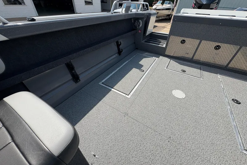Slide: The Image of Interior of 2026 Lund 210 HG boat with spacious deck and storage compartments. - 30