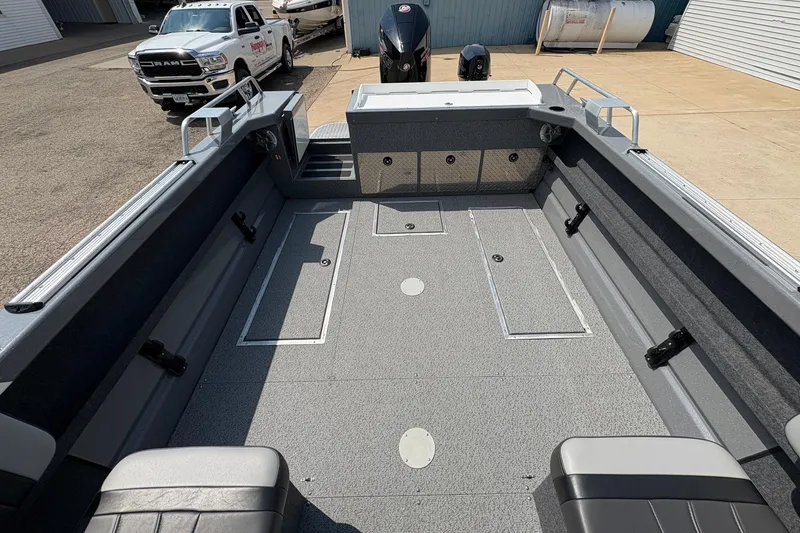 Slide: The Image of 2026 Lund 210 HG boat interior with spacious deck and seating. - 31