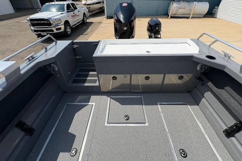 Slide: The Image of 2026 Lund 210 HG boat interior with spacious deck and storage compartments. - 37