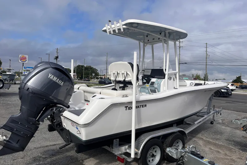 Slide: The Image of 2024 Tidewater 210 LXF boat with Yamaha engine on trailer, outdoor display. - 4