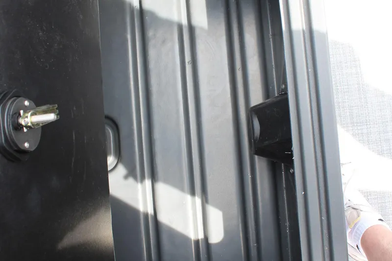 Slide: The Image of Interior view of 2026 Sun Tracker Party Barge 20 DLX, showing storage compartment. - 17