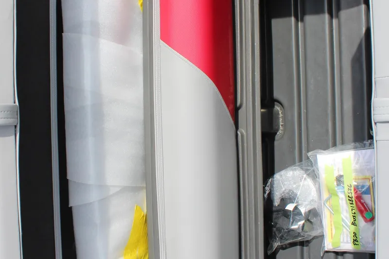 Slide: The Image of Interior view of 2026 Sun Tracker Party Barge 20 DLX with seat details and accessories. - 20