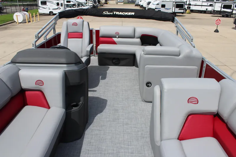 Slide: The Image of 2026 Sun Tracker Party Barge 20 DLX interior with gray and red seating, spacious layout. - 22
