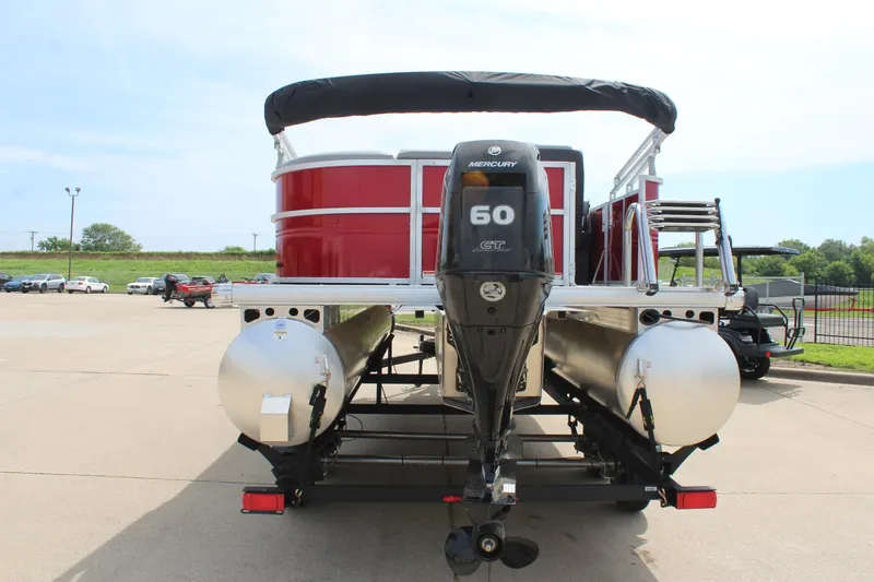 Slide: The Image of 2026 Sun Tracker Party Barge 20 DLX pontoon boat with Mercury 60 engine, rear view. - 6