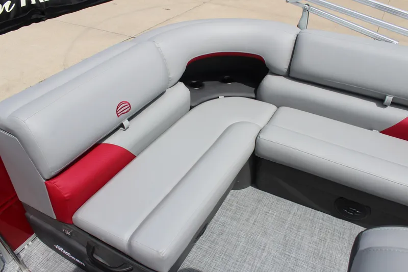 Slide: The Image of 2026 Sun Tracker Party Barge 20 DLX interior with gray and red cushioned seating. - 8