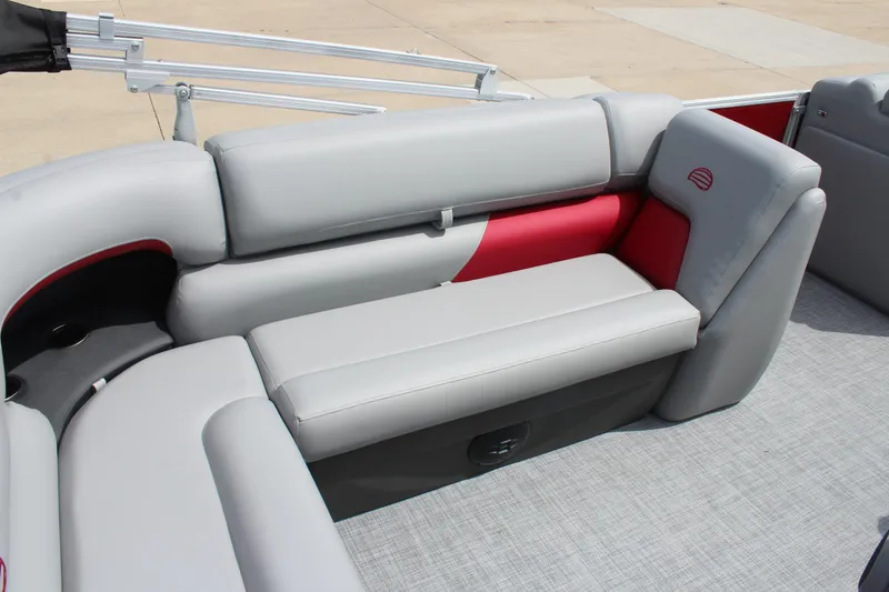 Slide: The Image of 2026 Sun Tracker Party Barge 20 DLX interior with gray and red seating. - 9