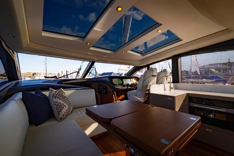 Slide: The Image of Luxurious interior of 2026 Princess V55 Express yacht with stylish seating. - 15