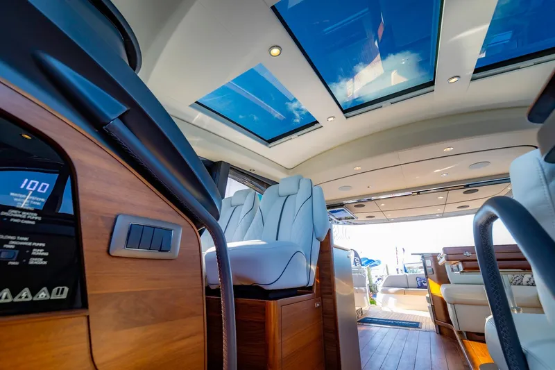 Slide: The Image of Luxury yacht Princess V55 Express 2026 docked under sunny skies. - 16