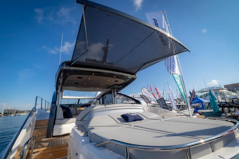 Slide: The Image of Luxury yacht Princess V55 Express 2026 docked at sunset. - 21