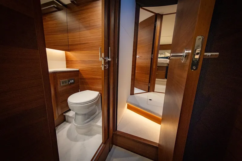 Slide: The Image of Luxurious bathroom window on the 2026 Princess V55 Express yacht. - 27