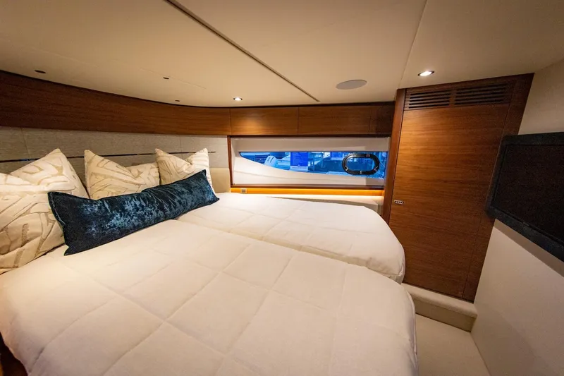Slide: The Image of Luxurious bedroom in Princess V55 Express yacht, model year 2026. - 34