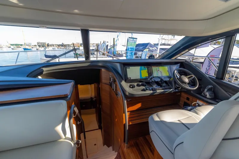 Slide: The Image of Interior of 2026 Princess V55 Express yacht with illuminated staircase. - 38