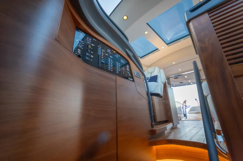 Slide: The Image of 2026 Princess V55 Express yacht cockpit with navigation screens. - 44
