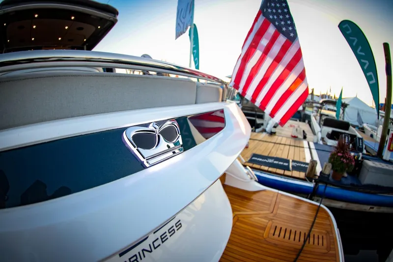 Slide: The Image of Luxury yacht Princess V55 Express 2026 in harbor, modern design. - 48