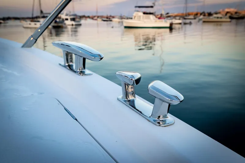 Slide: The Image of 2026 Princess V55 Express yacht at dock with wooden deck. - 50