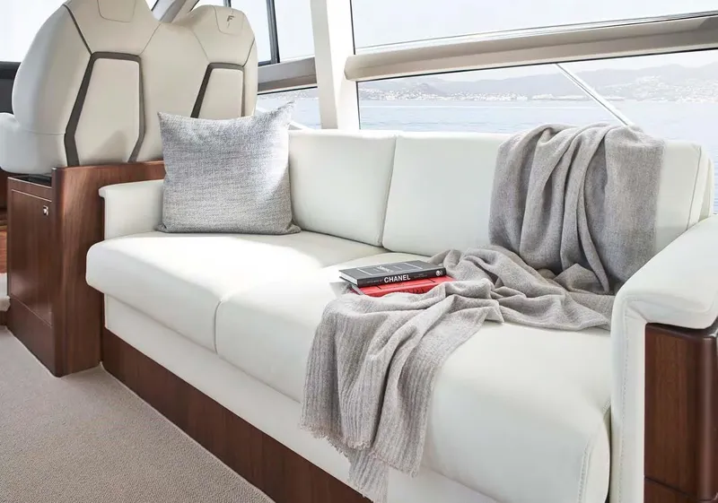 Slide: The Image of Luxurious interior of 2025 Princess 50 Flybridge yacht with elegant white sofa and decor. - 14