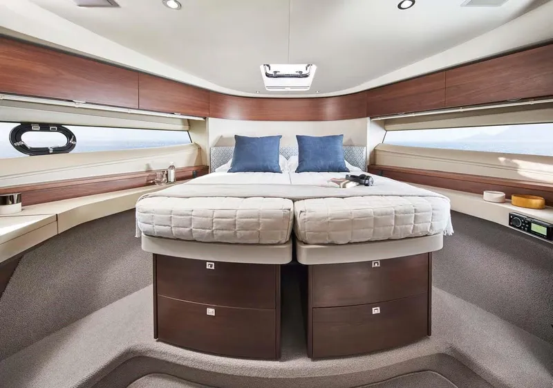 Slide: The Image of Luxurious 2025 Princess 50 Flybridge yacht bedroom with modern design and elegant furnishings. - 18