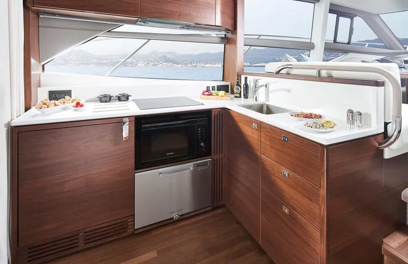 Slide: The Image of Modern kitchen interior on 2025 Princess 50 Flybridge yacht with ocean view. - 8