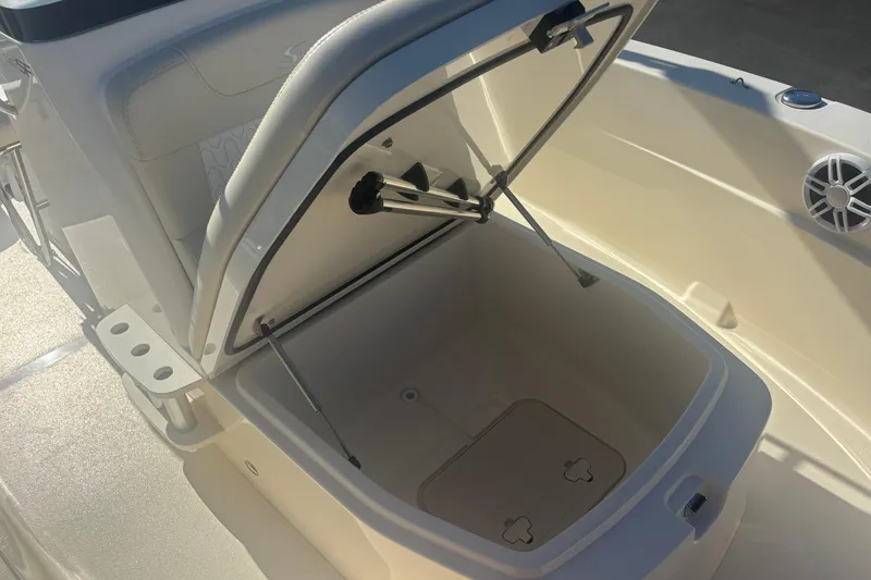 Slide: The Image of 2026 Scout 188 Sportfish boat storage compartment with open lid and hydraulic support. - 17