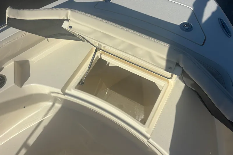 Slide: The Image of Open storage compartment on 2026 Scout 188 Sportfish boat, showcasing interior space. - 18