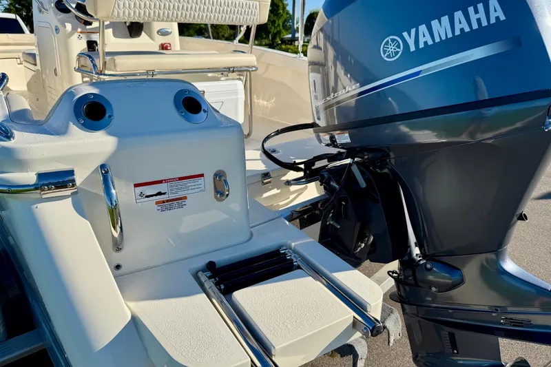 Slide: The Image of 2026 Scout 188 Sportfish boat with Yamaha outboard motor, featuring a sleek design. - 6
