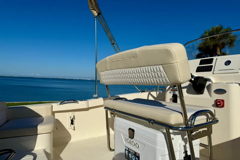 Slide: The Image of 2026 Scout 188 Sportfish boat interior with seating and ocean view. - 9