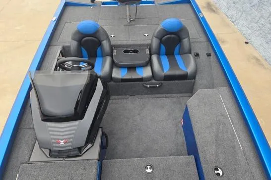 Slide: The Image of 2026 Vexus AVX189D boat interior with blue and black seating, steering console, and storage compartments. - 3