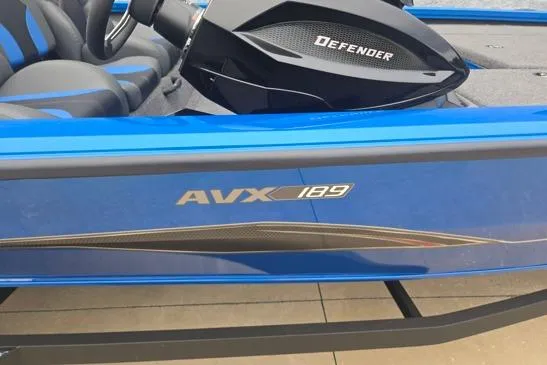 Slide: The Image of 2026 Vexus AVX189D boat with Defender steering, blue exterior detailing. - 5