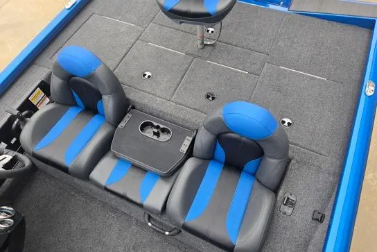 Slide: The Image of 2026 Vexus AVX189D boat interior with blue and black seating and carpeted flooring. - 6