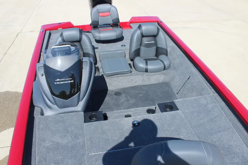 Slide: The Image of 2026 Tracker Pro Team 195 boat interior with gray seating and red accents. - 14