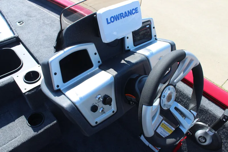 Slide: The Image of 2026 Tracker Pro Team 195 boat dashboard with steering wheel and Lowrance electronics. - 17