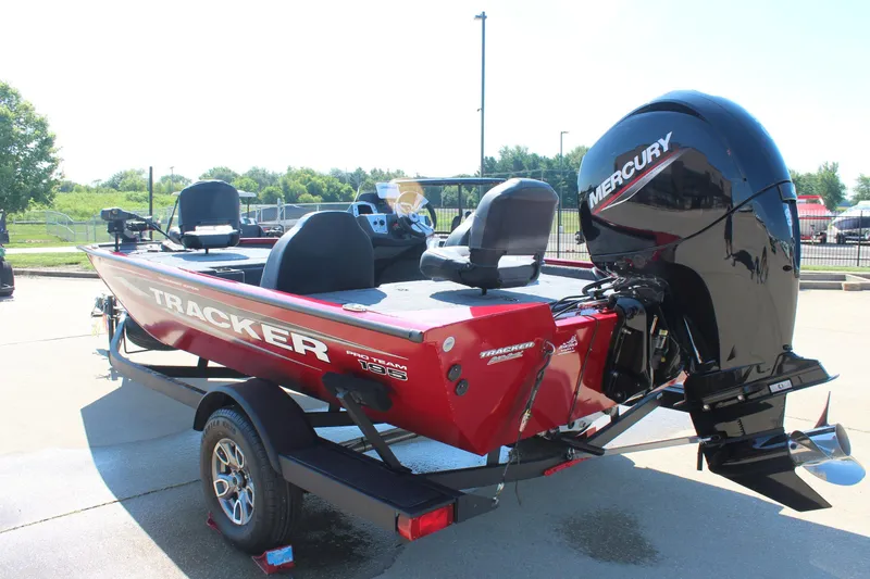 Slide: The Image of 2026 Tracker Pro Team 195 boat with Mercury engine, parked outdoors. - 6