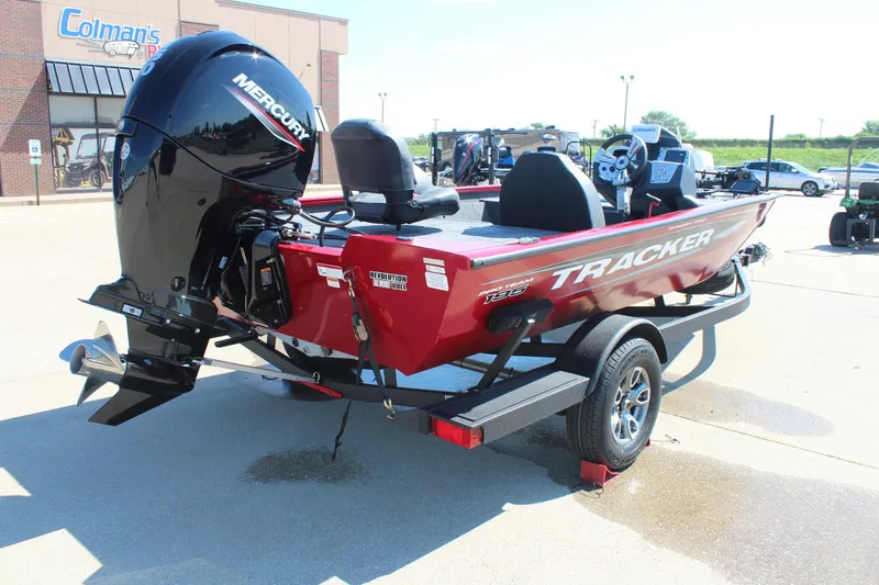 Slide: The Image of 2026 Tracker Pro Team 195 boat with Mercury engine, displayed outdoors on a trailer. - 8