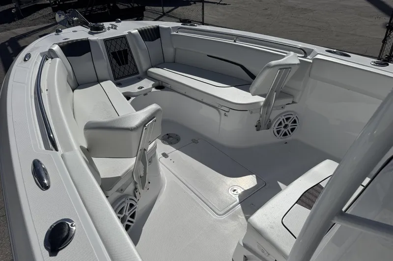 Slide: The Image of 2025 Wellcraft 242 Fisherman boat interior with seating and storage compartments. - 13