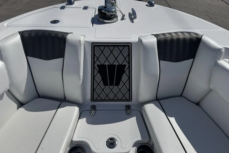 Slide: The Image of 2025 Wellcraft 242 Fisherman boat interior with white cushioned seating and sleek design. - 14