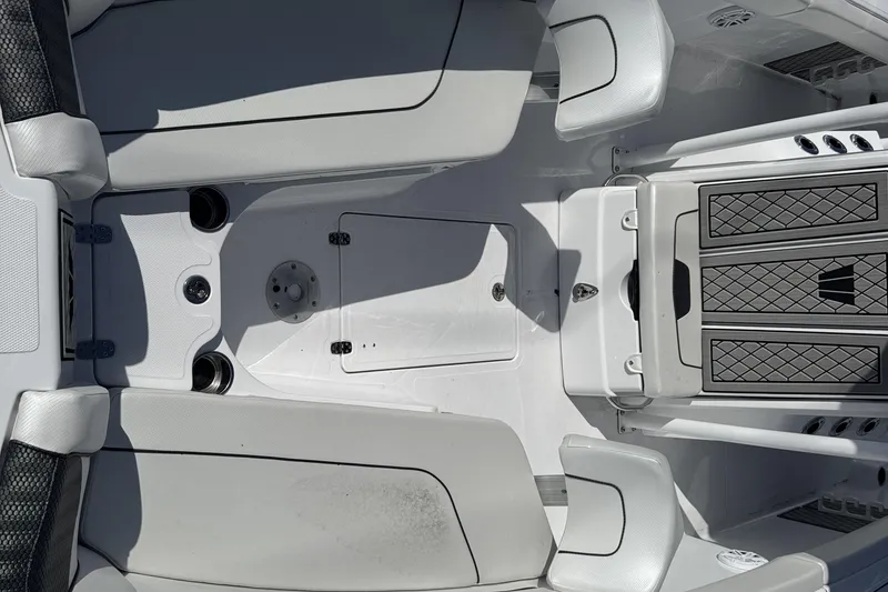 Slide: The Image of 2025 Wellcraft 242 Fisherman boat interior with sleek seating and storage compartments. - 16